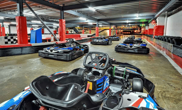 photo of a blue go kart on an indoor track